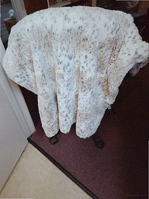 Nichole Miller animal print throw. Soft, neutral colors. reversible. Warm, cozy